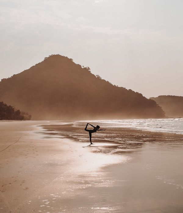 Woman in a serene yoga pose, embodying balance and calm.